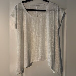 Beautiful light and airy handkerchief style top with gorgeous burnout design.